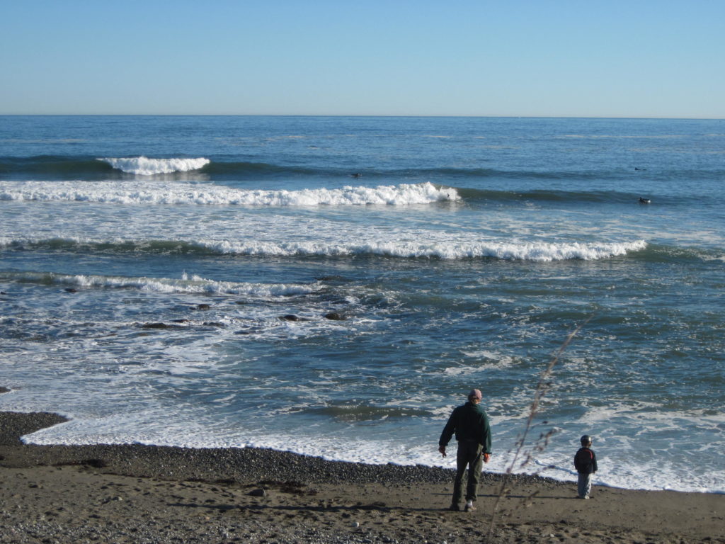 Portsmouth NH oceanfront beach with man and boy fishing