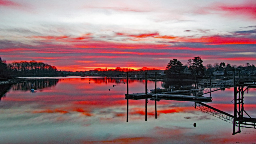 Brilliant red sunrise over Piscataqua River in Portsmouth, NH 